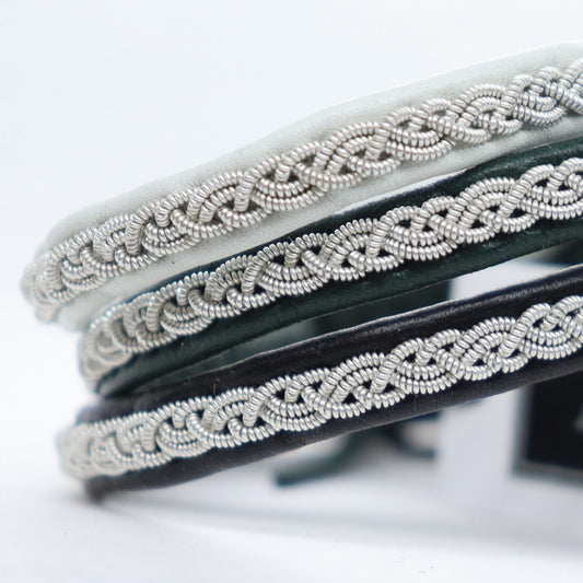 Close up of handcrafted narrow Sami bracelets