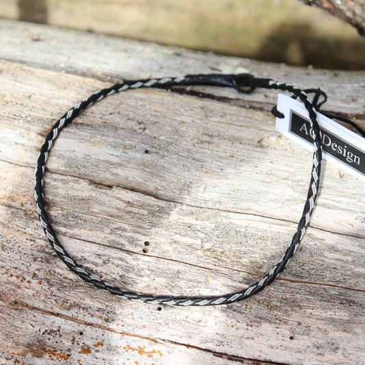 Sami‑style round‑braided necklace crafted from pewter thread and leather.