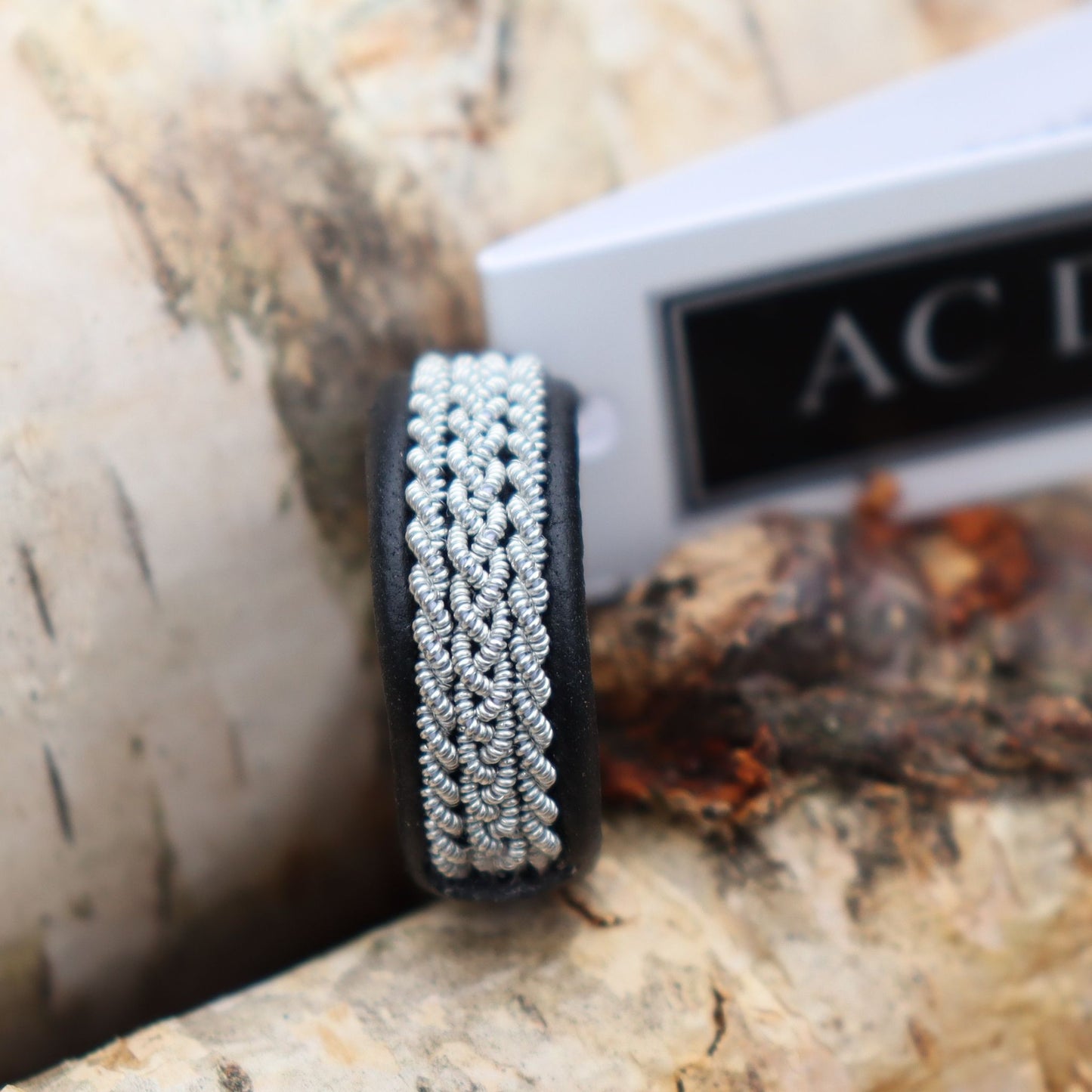 Swedish Sami ring in black reindeer leather and braids in pewter
