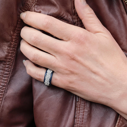 Sami ring in leather with pewter braid, worn on finger