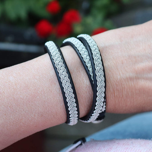 3-wrap Sami bracelet in black reindeer leather worn on wrist