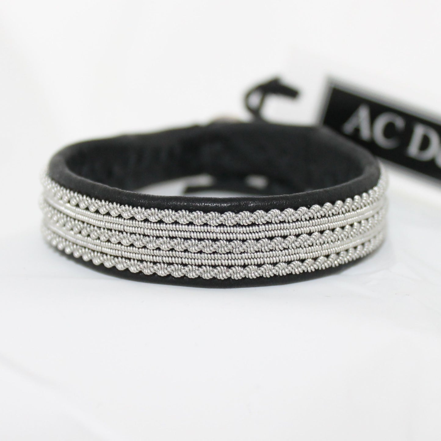 Black Sami bracelet in leather and pewter thread.