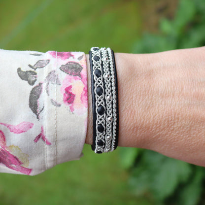 Nordic Sami bracelet in reindeer leather and silver beads worn on wrist