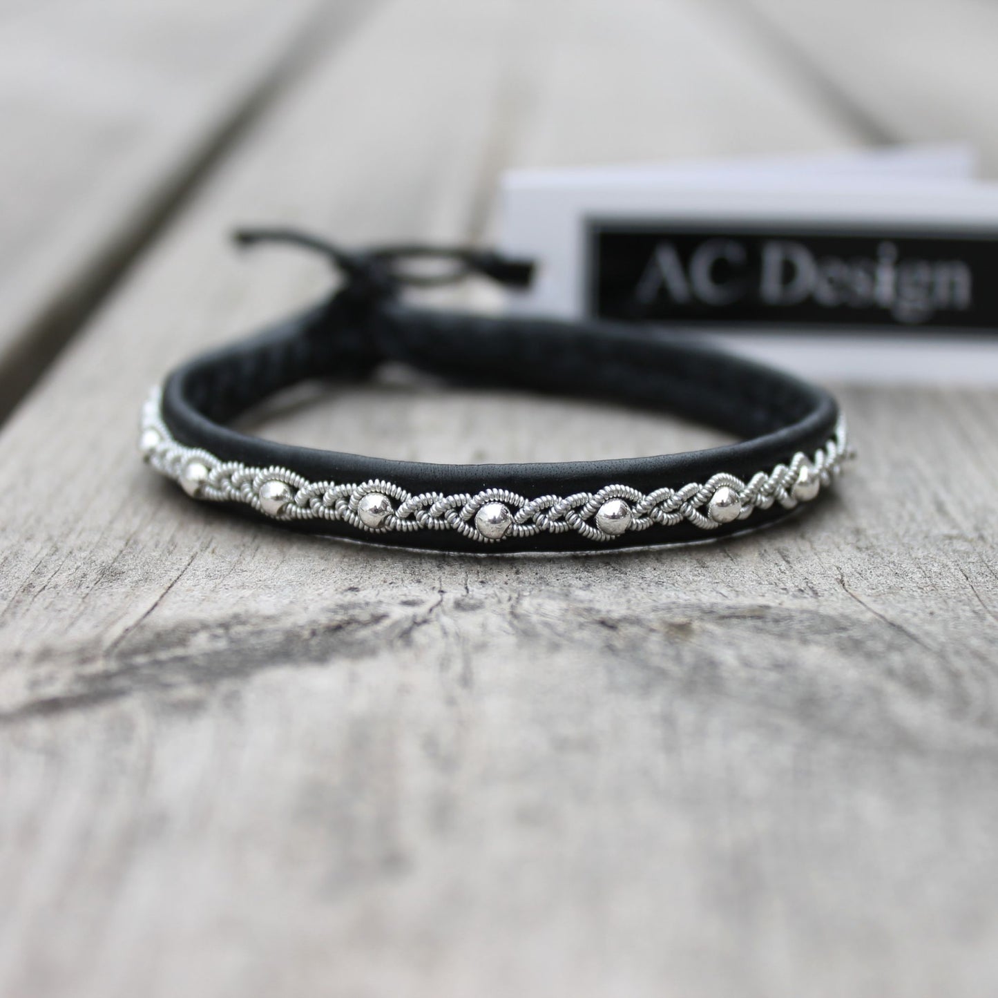 Handcrafted slim Sami leather bracelet with braided pewter thread and silver bead accents