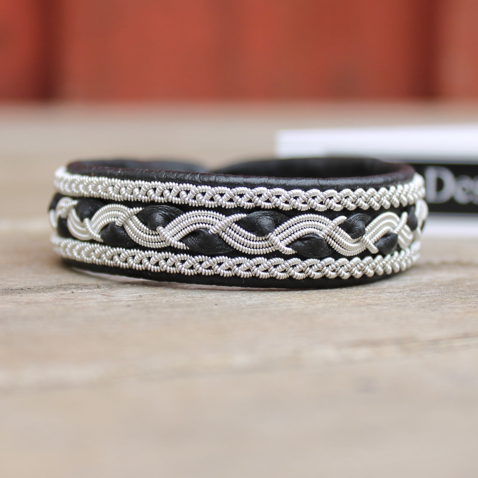 Handcrafted Sami bracelet in black leather with pewter braids