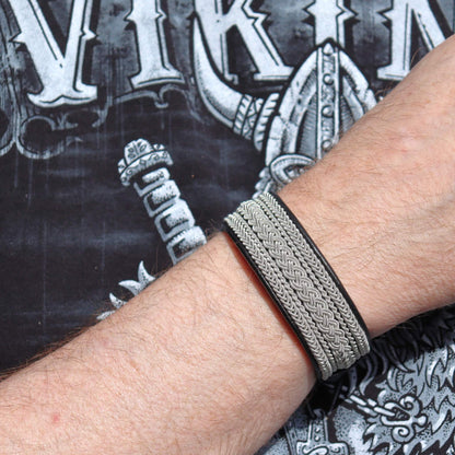 Sami bracelet in reindeer leather with pewter braids shown on wrist