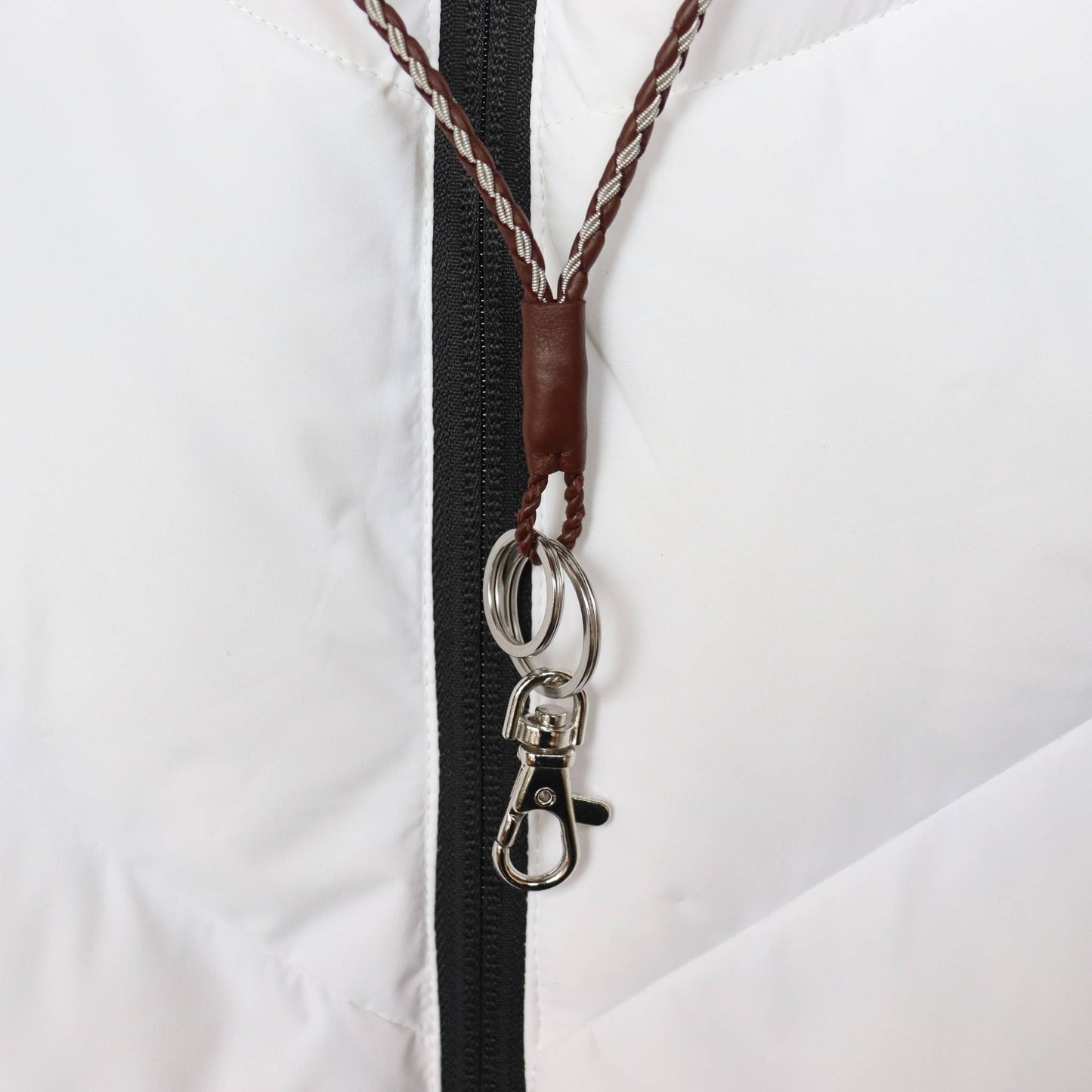 Handcrafted Sámi lanyard in brown leather and pewter wire, featuring a hook and key rings