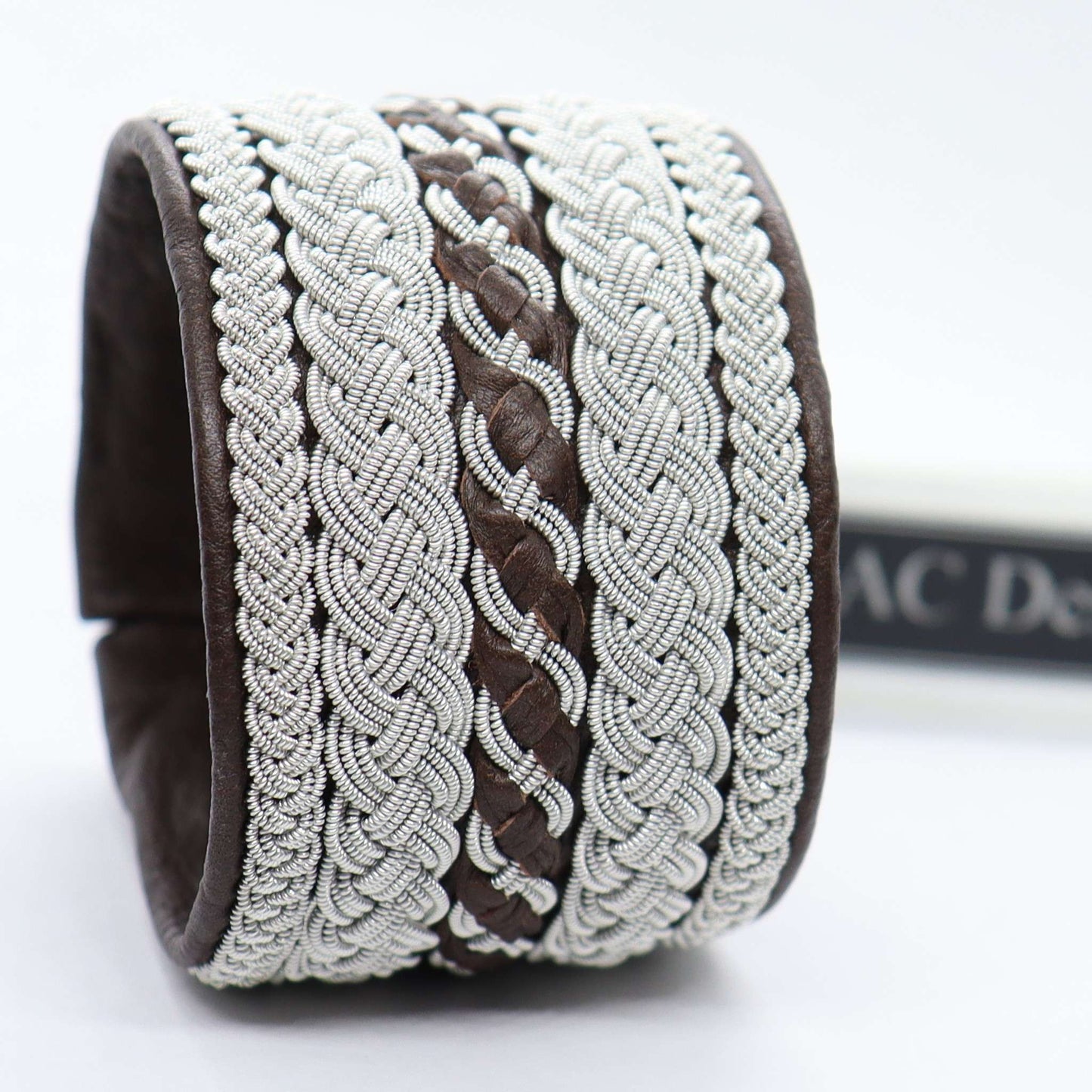 Handcrafted Sami bracelet in dark brown reindeer leather and pewter wire
