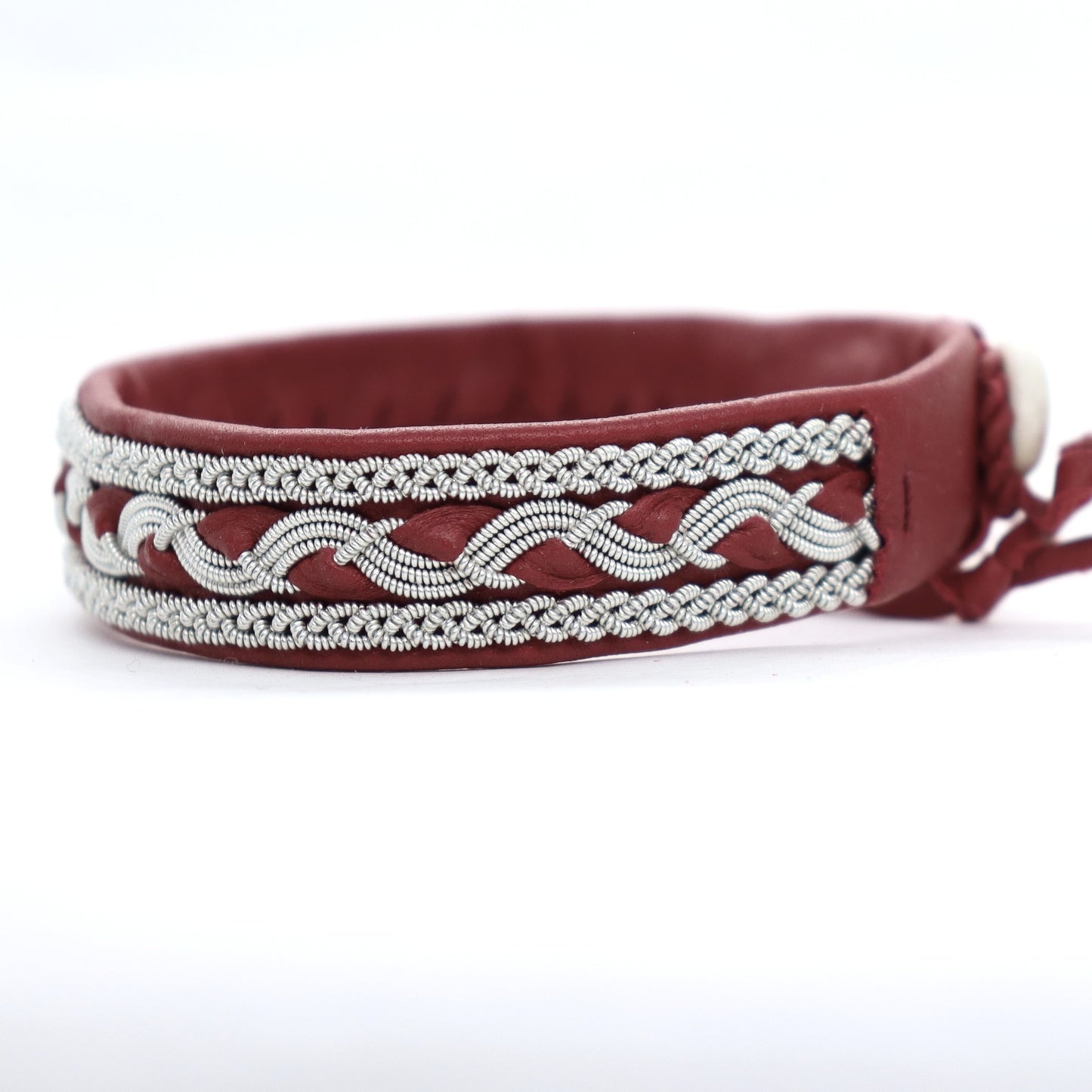 Handcrafted Sami bracelet in red leather with braided pewter thread