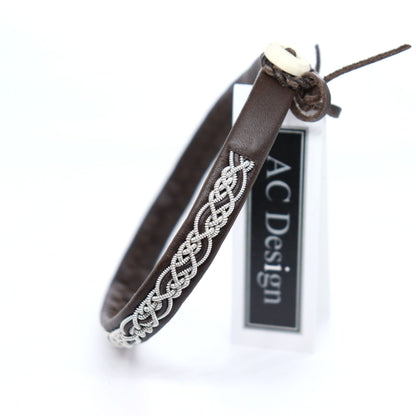 Sami bracelet with braided pewter thread and a leather cord braided into the pattern