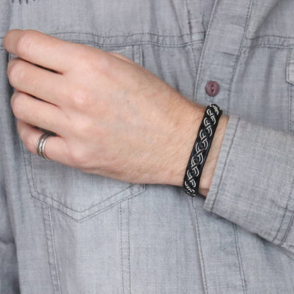 Sami bracelet with a braid combining pewter thread and black copper wire worn on wrist