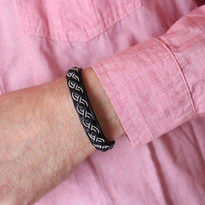  Sami bracelet with a braid combining pewter thread and copper wire worn on wrist