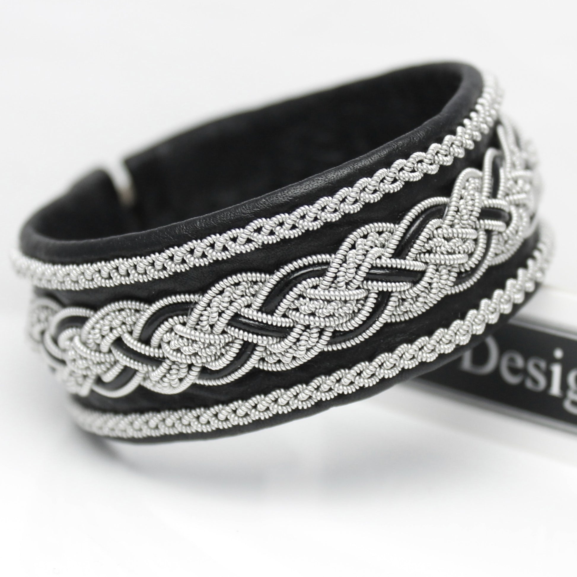 Black handcrafted Sami bracelet in soft leather with pewter braid and leather cord accents