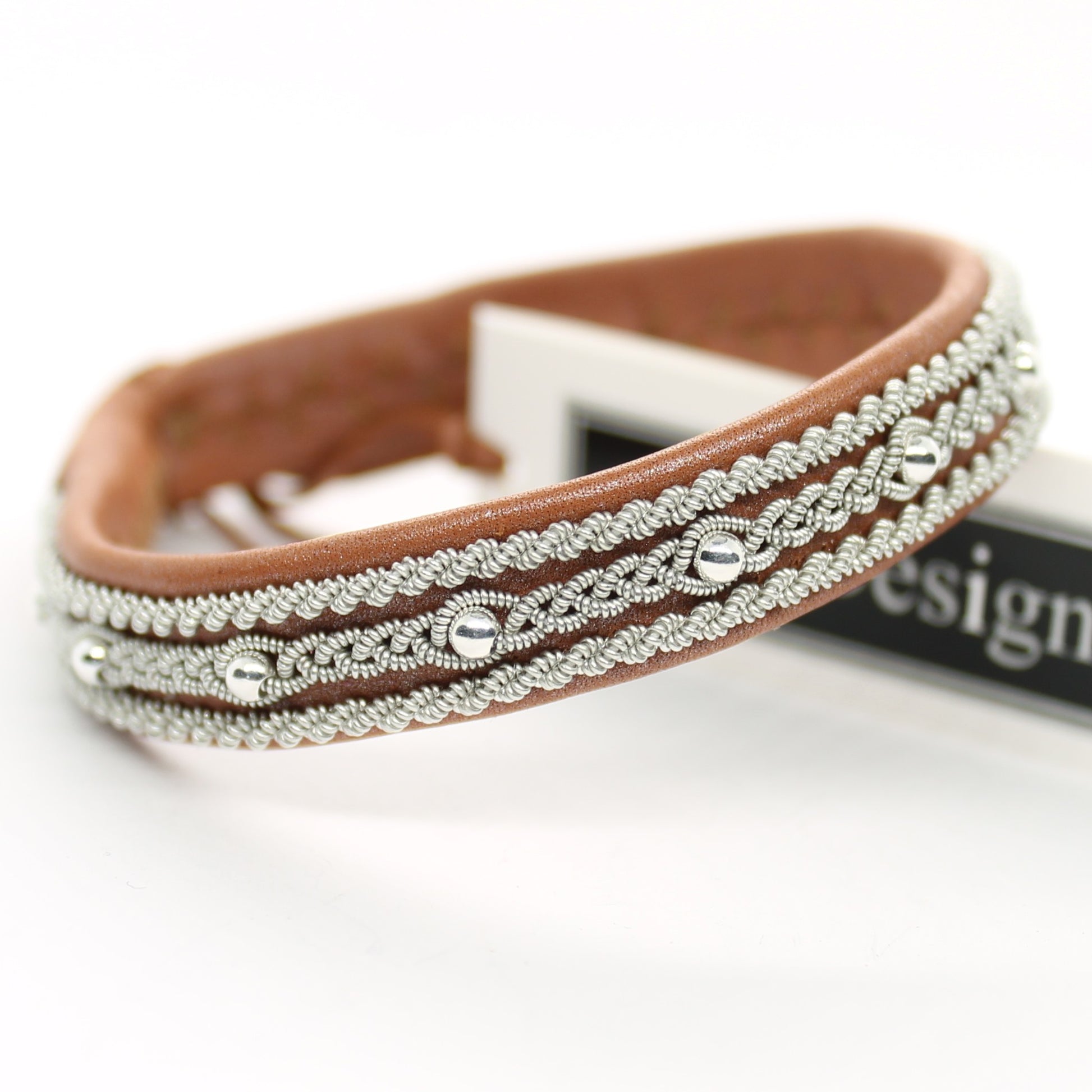 Sami bracelet made from reindeer leather with braided pewter wire and silver beads