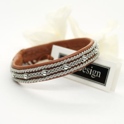 Sami bracelet made from soft leather with braided pewter thread and silver beads