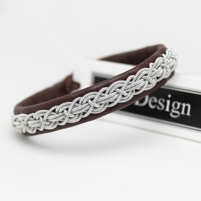 Artisan-made leather Sami style bracelet with braided pewter thread