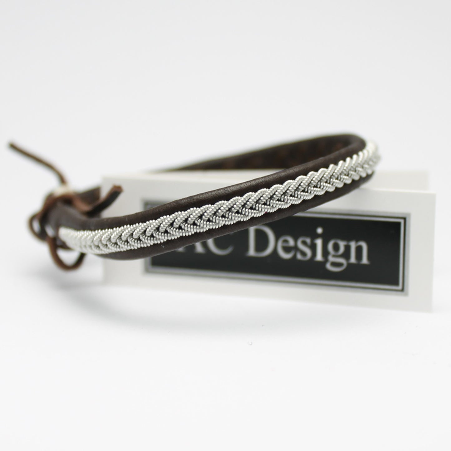 Sami bracelet with pewter wire braid and leather color dark brown
