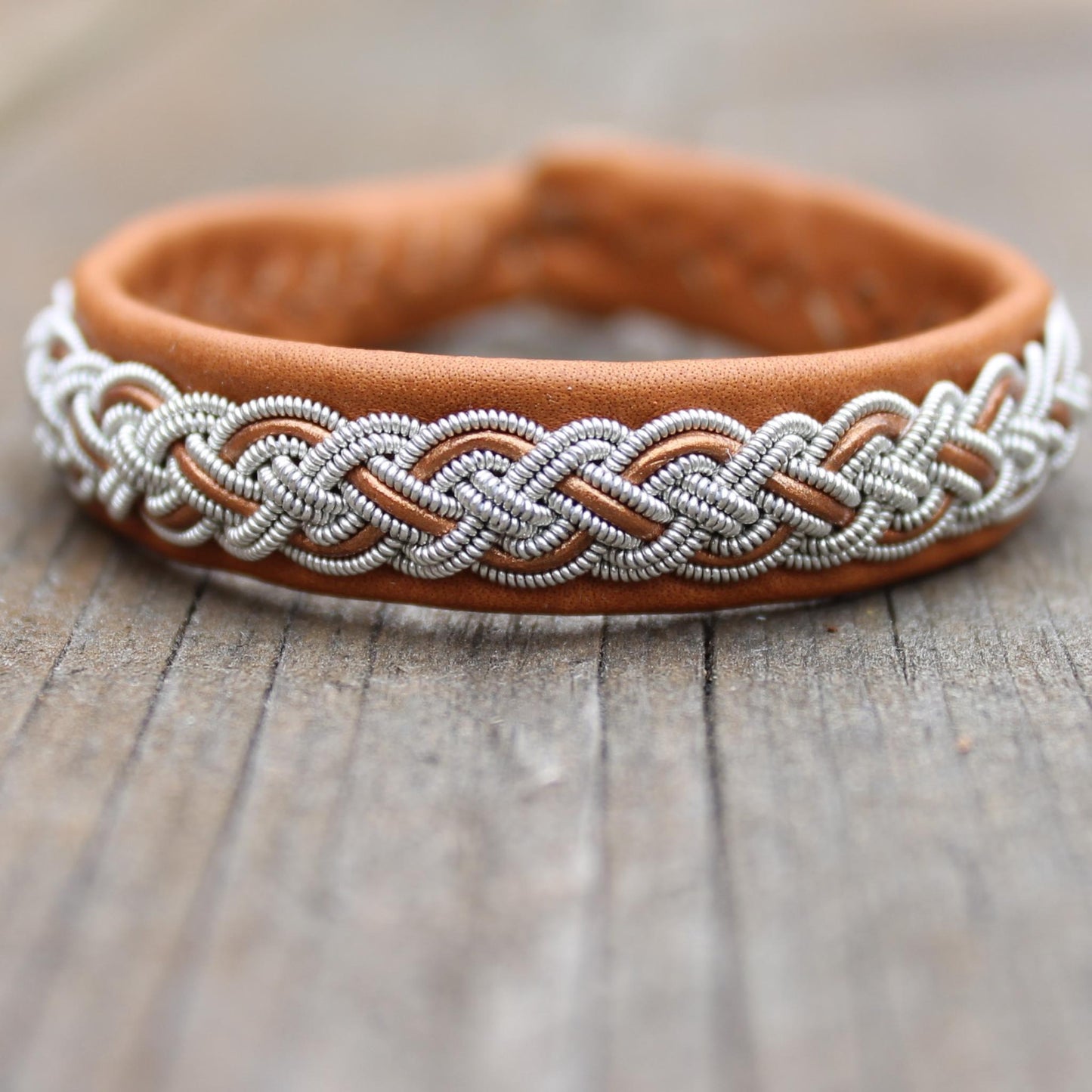 sami bracelet handmade from leather, pewter thread and leather cord in color muscade and bronze