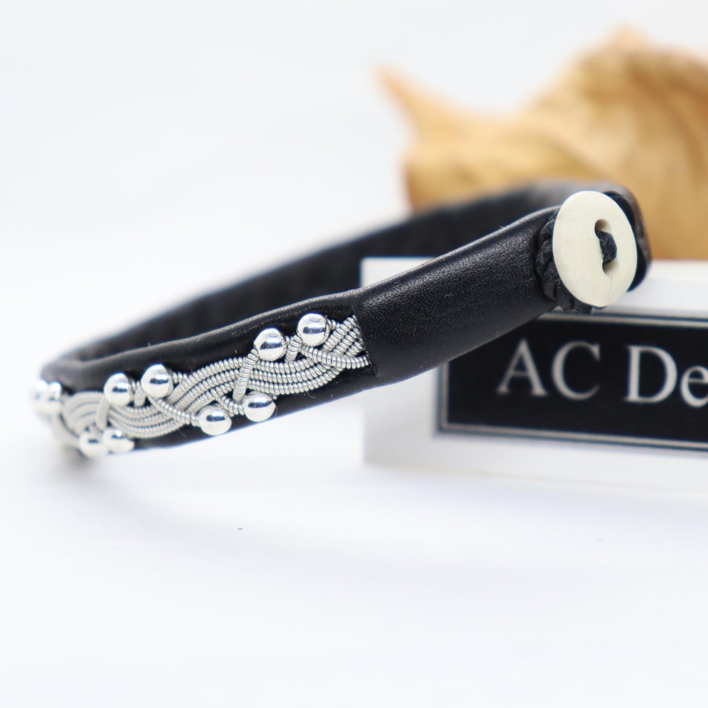 Horn button on a Sami leather bracelet with sterling silver beads.