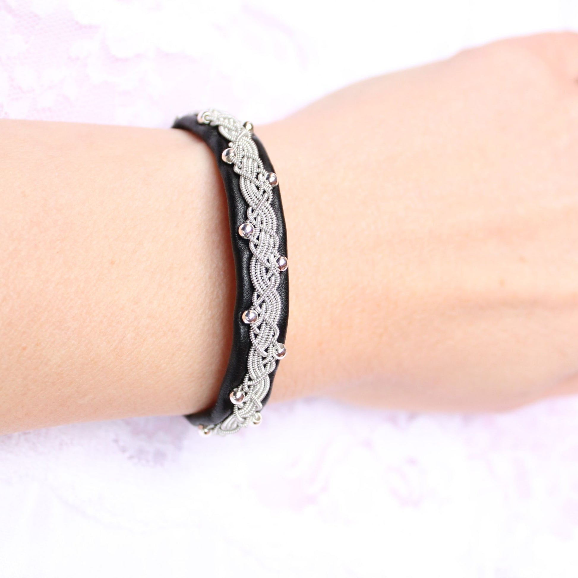 Sami bracelet with silver beads and black leather