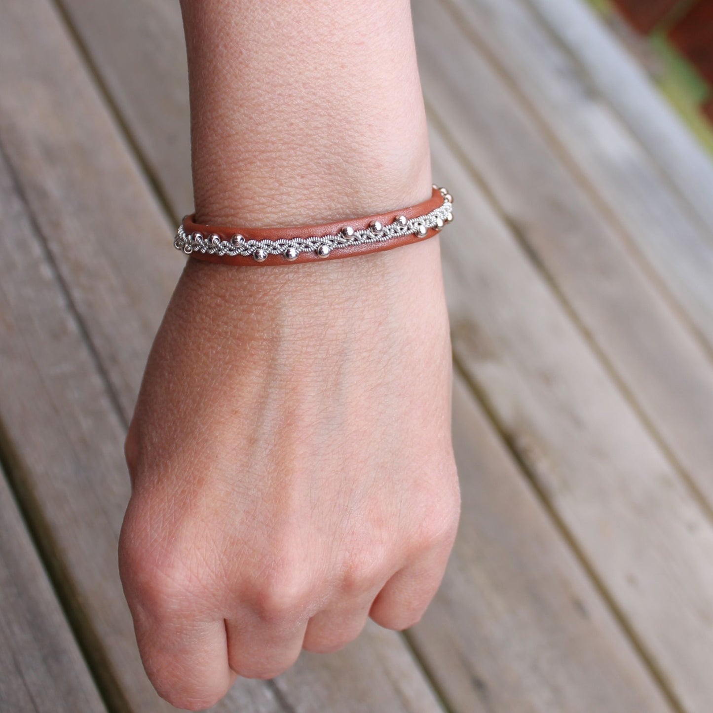 Sami bracelet with sterling silver beads on a womans wrist