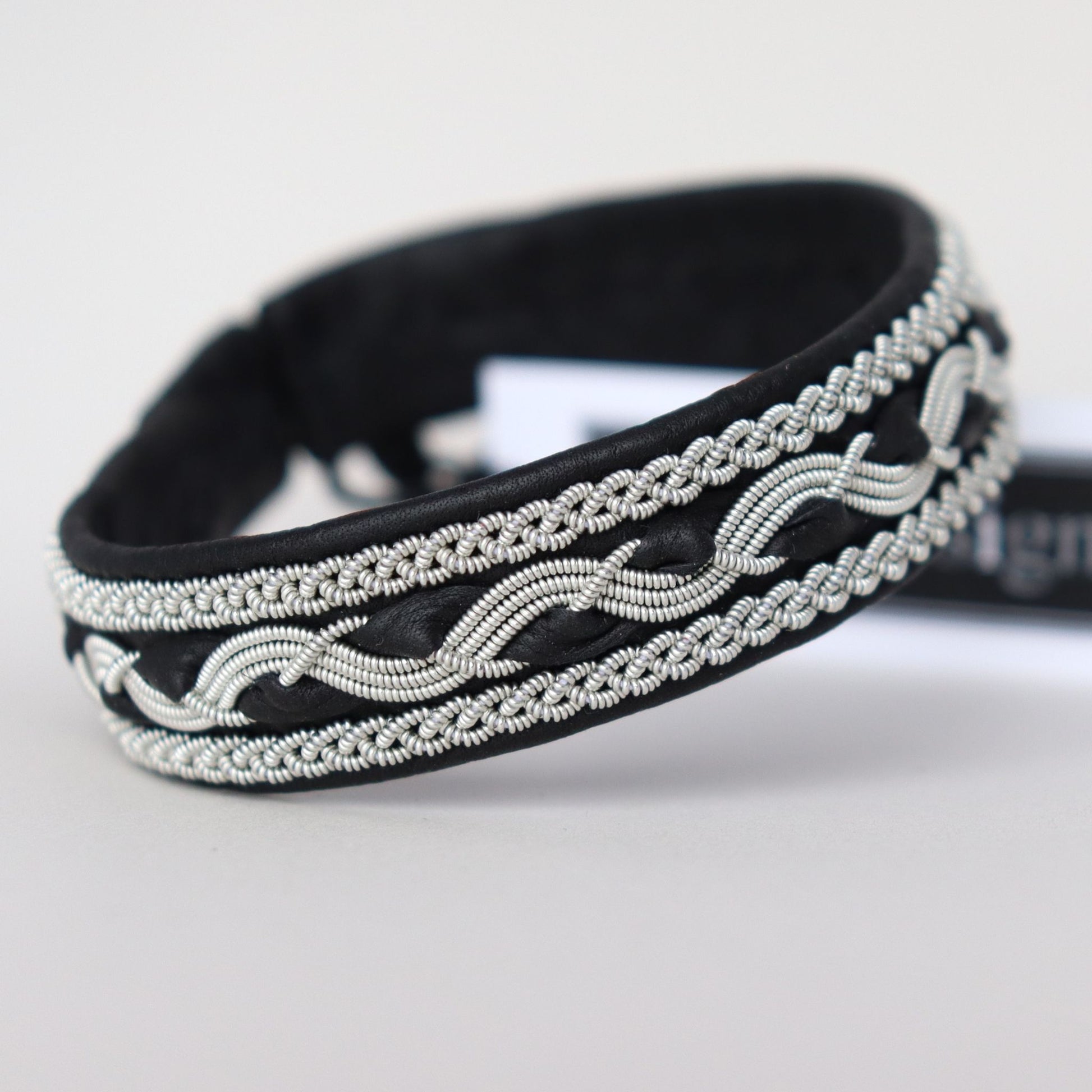 Close-up of a handcrafted black sami style bracelet