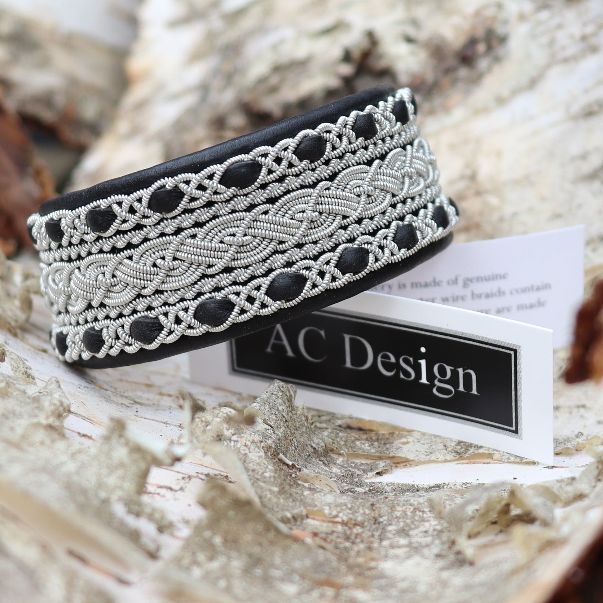 Sami bracelet cuff style in black leather, rest on AC Design label