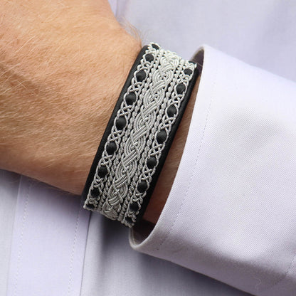 Sami bracelet cuff style in black leather, worn on wrist