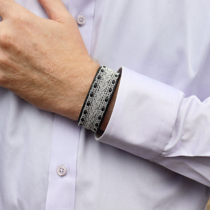 Sami bracelet cuff in black leather, worn on wrist