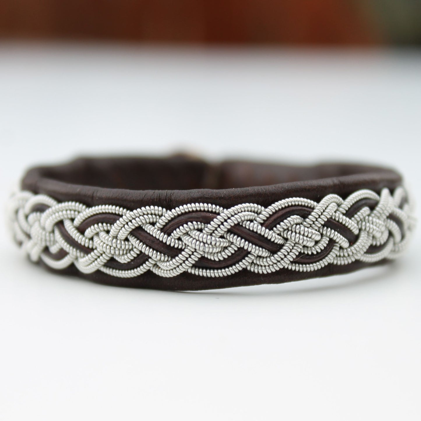 Handmade sami bracelet in dark brown leather, pewter thread and leather cord  