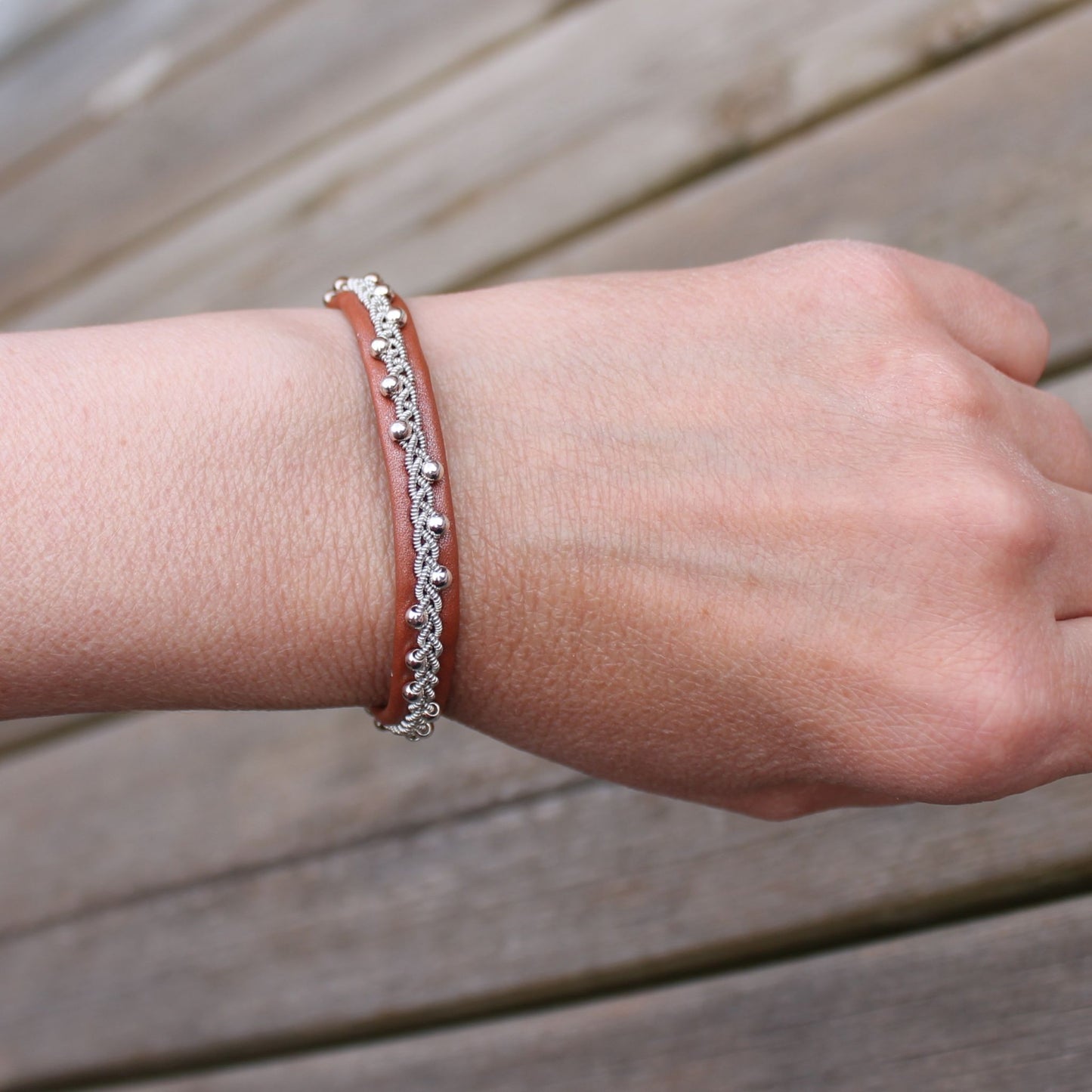 Bracelet with sterling silver beads on a womans wrist