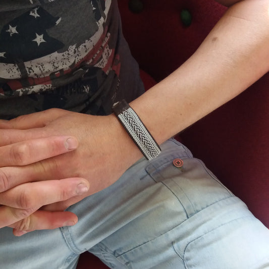 Sami pewter bracelet worn on mans wrist