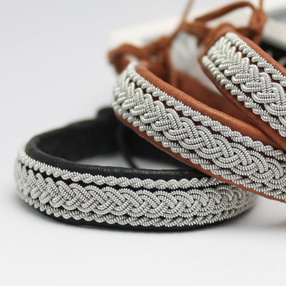 Nordic Sami leather bracelets with braided pewter thread shown in a close-up