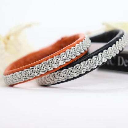 Sami bracelets in reindeer color orange and black.