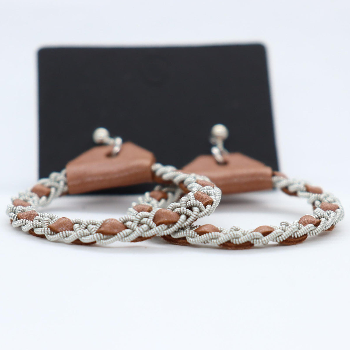 Sami earrings in reindeer leather and pewter braids.