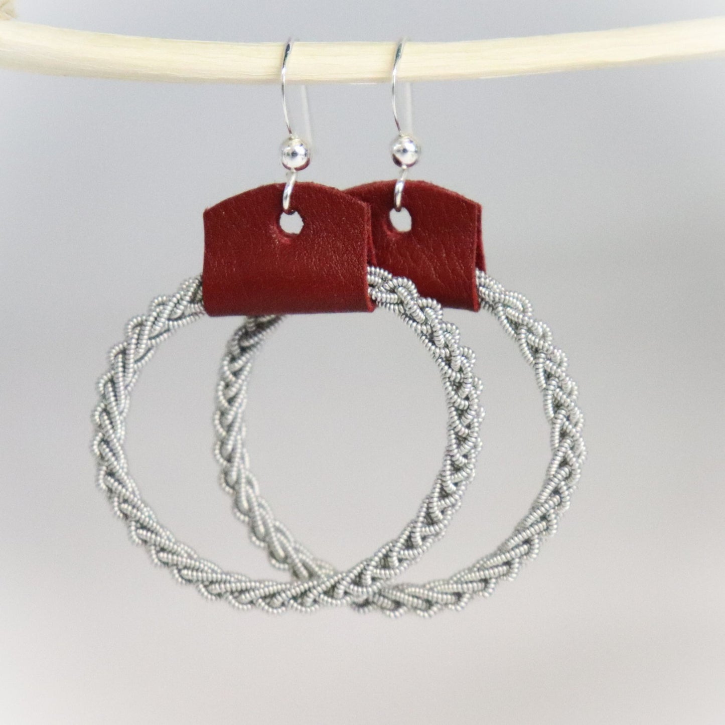 Sami-style leather and pewter wire earrings with sterling silver hooks