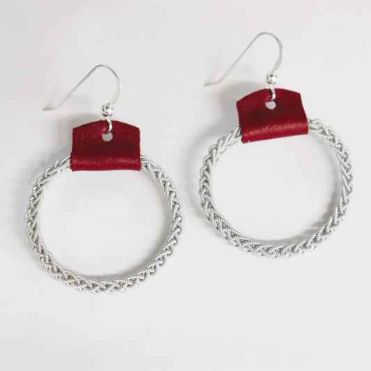 A pair of Sami leather and pewter wire earrings with sterling silver hooks
