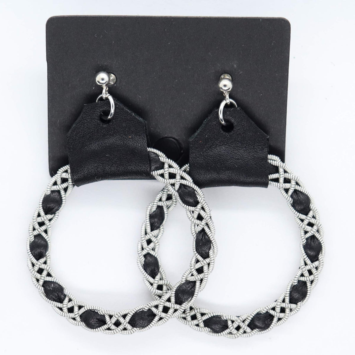 Sami earrings in Black reindeer leather and pewter braids.