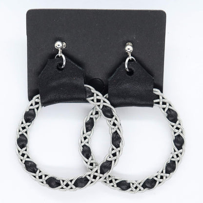 Sami earrings in Black reindeer leather and pewter braids.