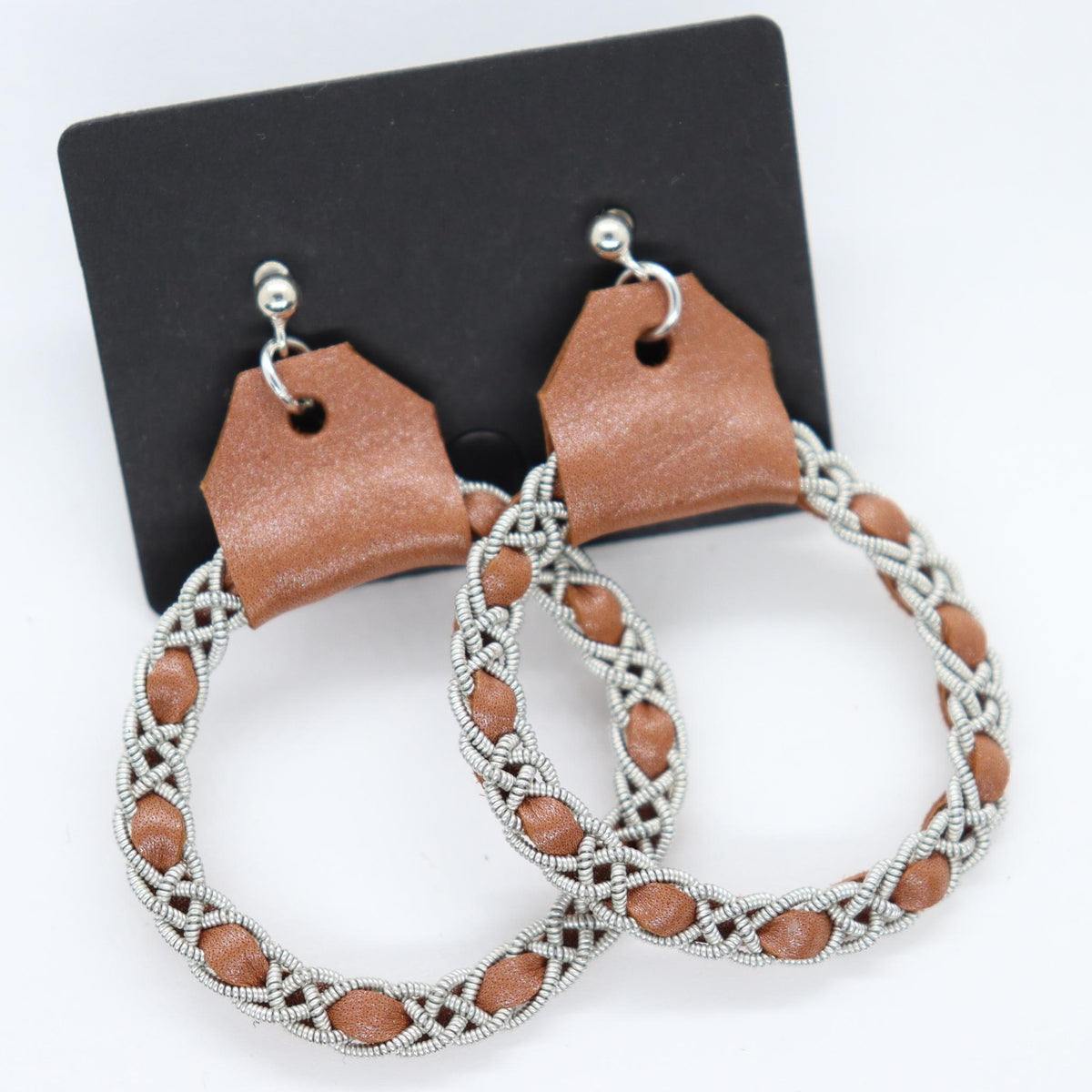 Sami earrings in Pearl Sienna reindeer leather color and pewter braids.