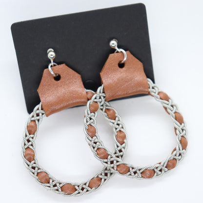 Sami earrings in Pearl Sienna reindeer leather color and pewter braids.