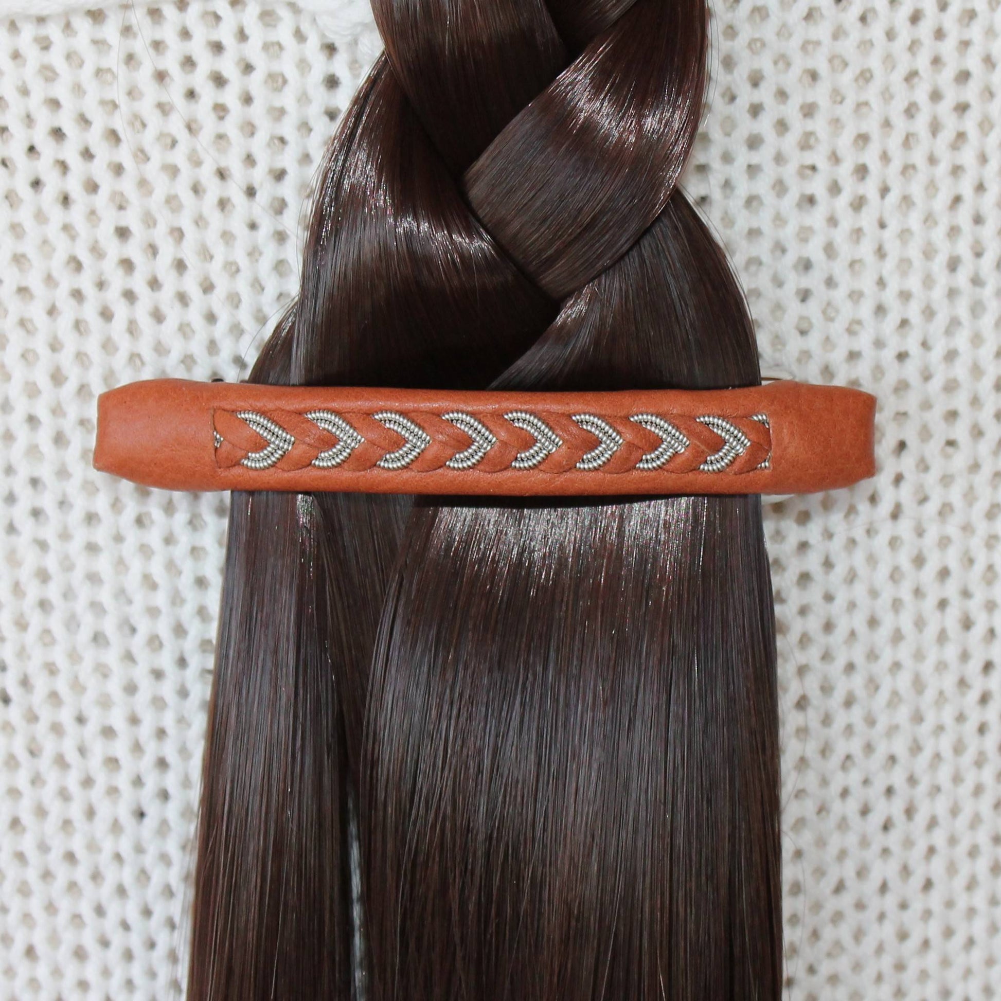 Handvrafted Sami hair clip used to secure a braid