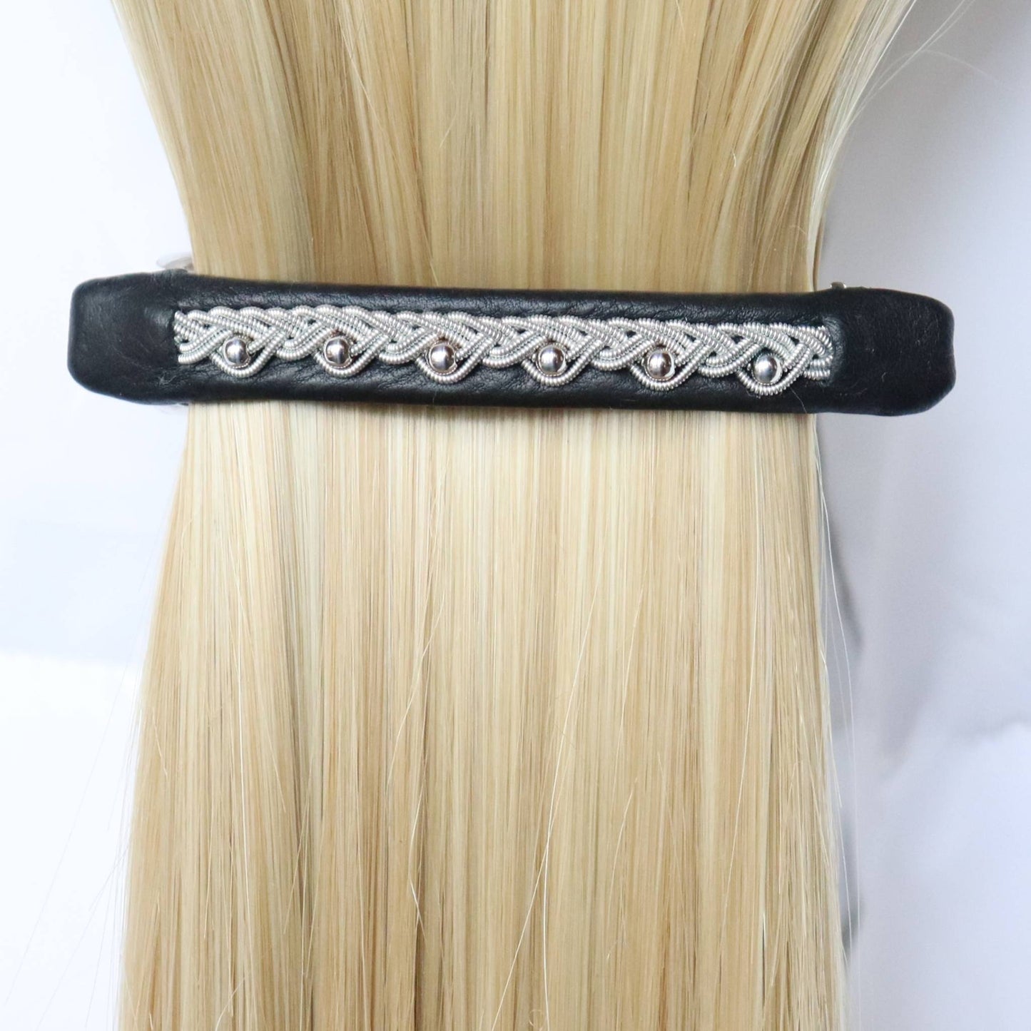 Black Sami leather hair barrette with a pewter braid and silver beads, worn in hair