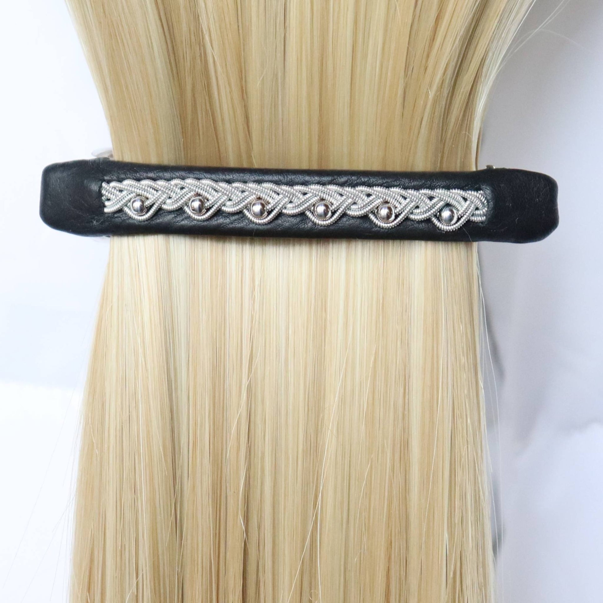 Black Sami leather hair barrette with a pewter braid and silver beads, worn in hair