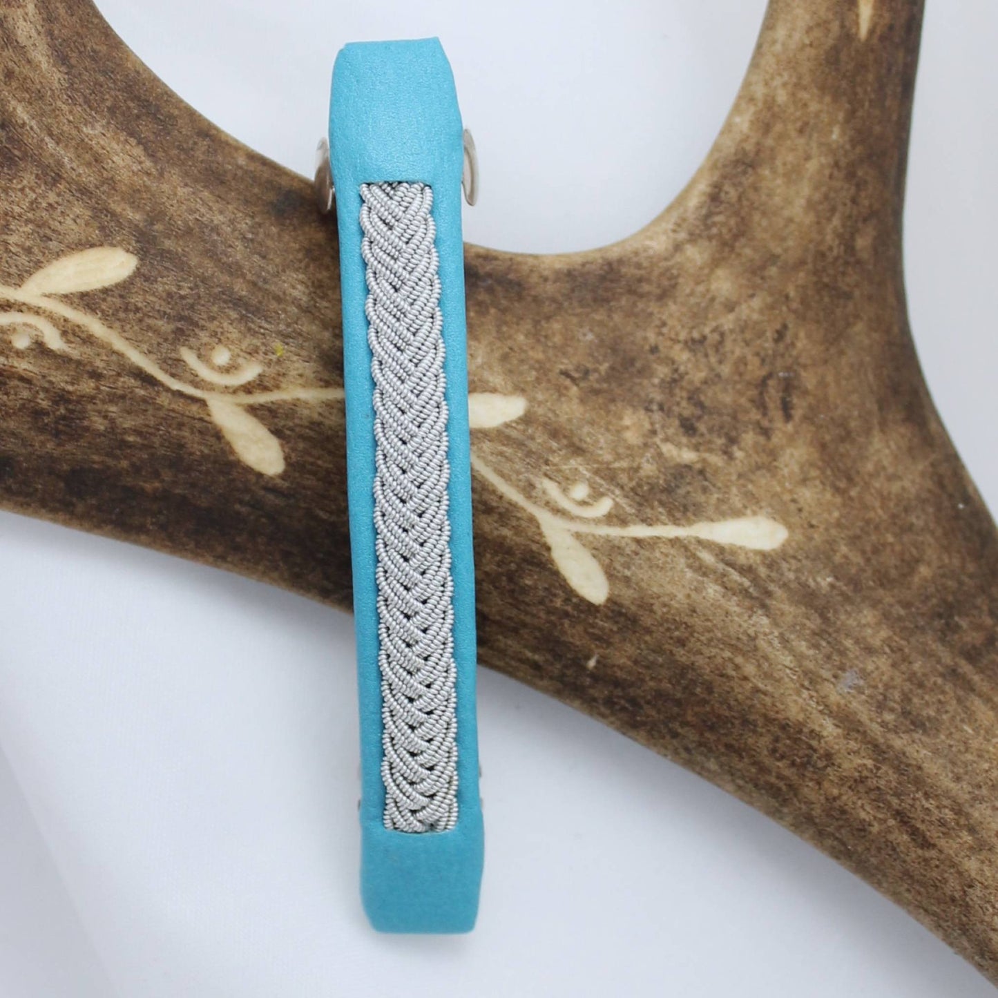 Handcrafted swedish Sami hair clip made from leather and pewter thread