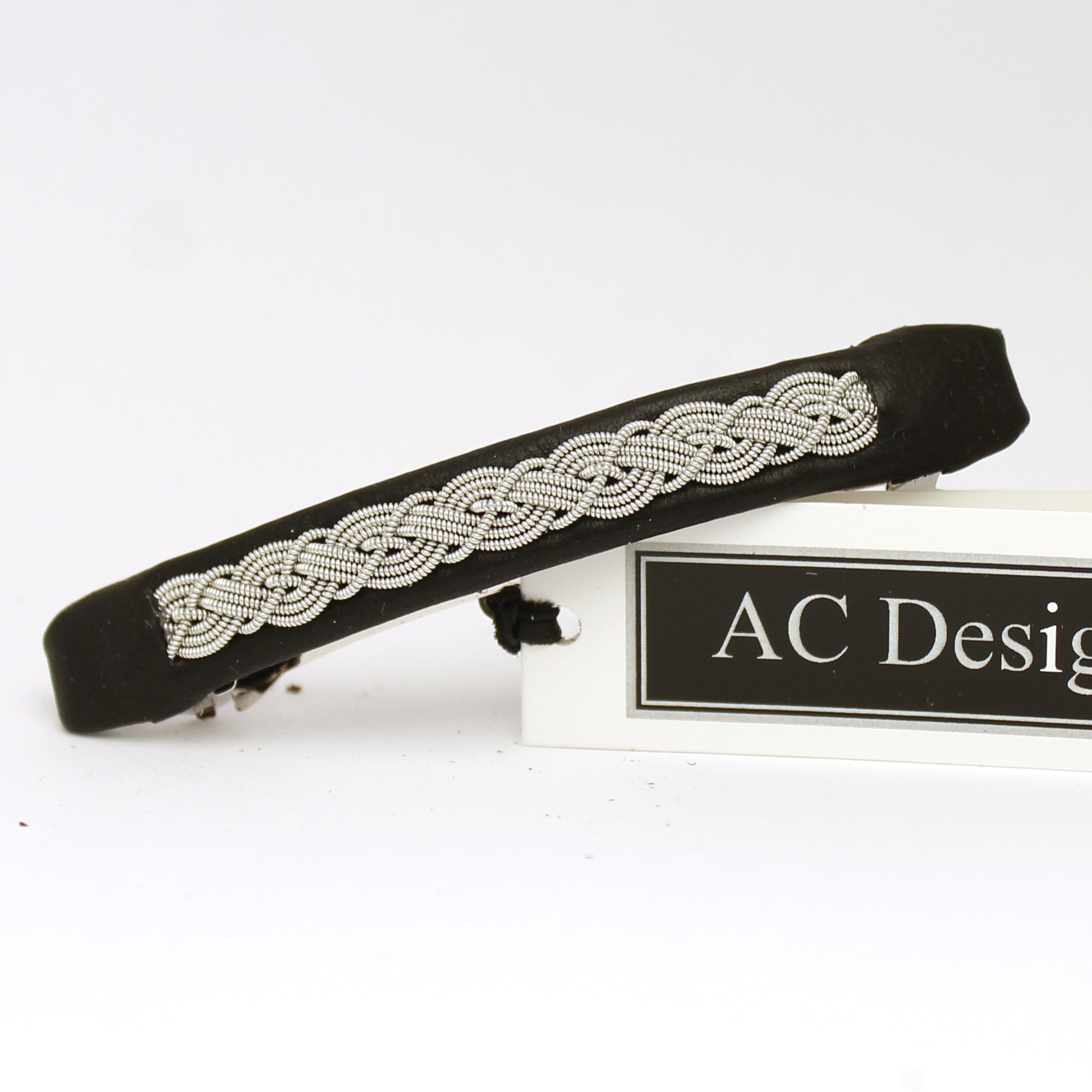 Handmade Sami hair barrette made from black leather and pewter wire.