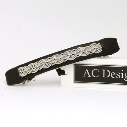 Handmade Sami hair barrette made from black leather and pewter wire.