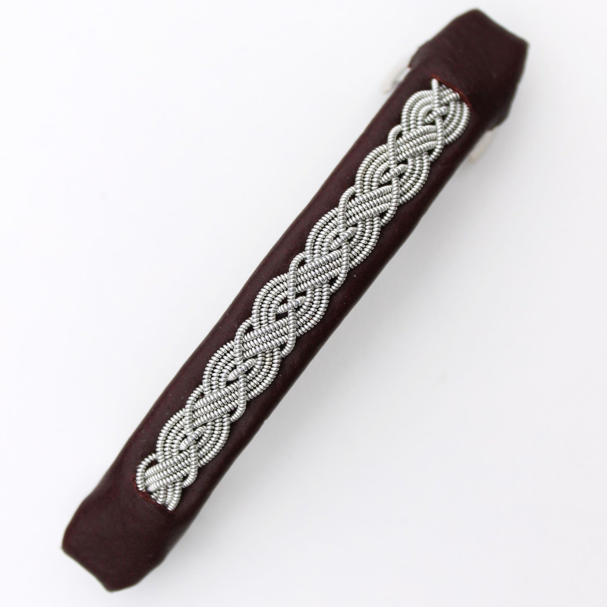 Handcrafted Sami style hair clip made from reindeer leather and pewter thread.