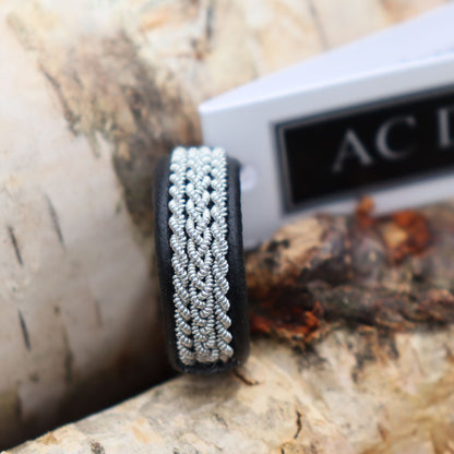 Swedish Sami ring in black reindeer leather and braids in pewter