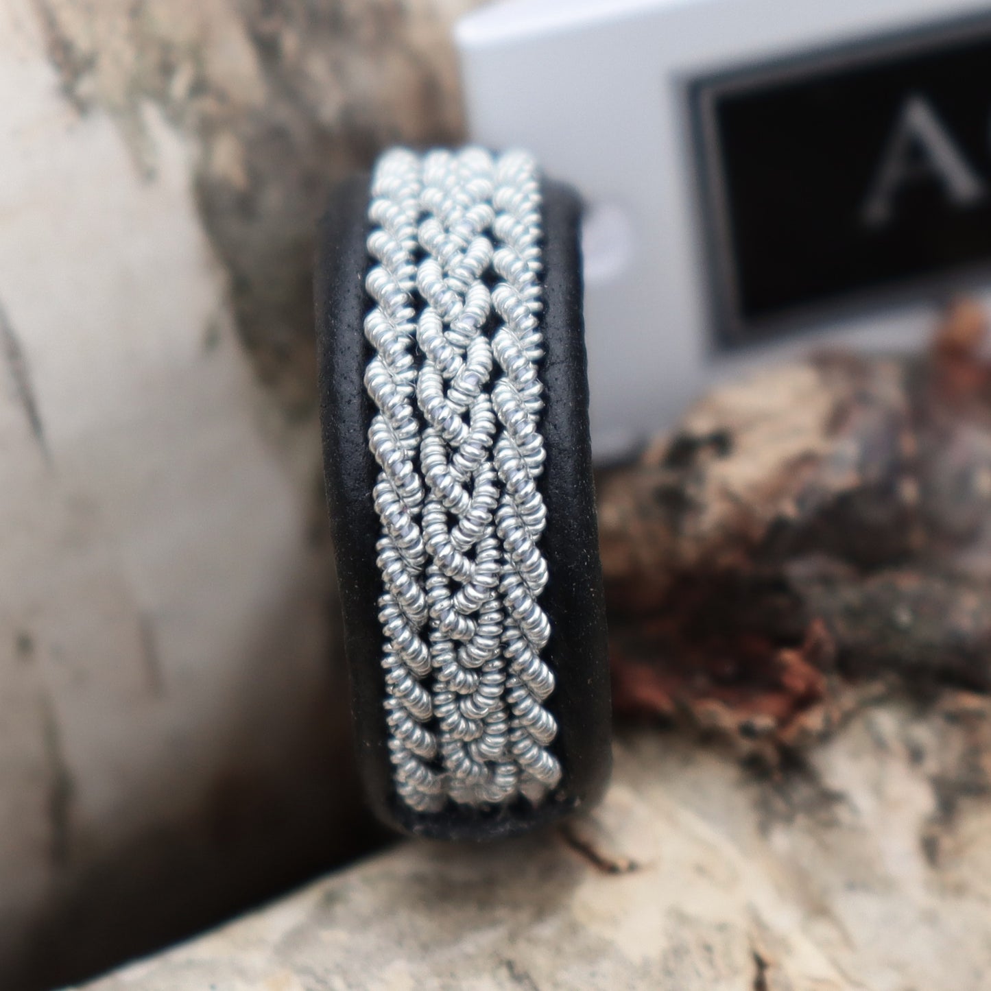 Sami ring in black reindeer leather and braids in pewter
